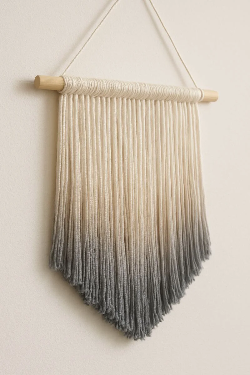 ombre yarn fringe wall hanging with wooden dowel and gradient tassels