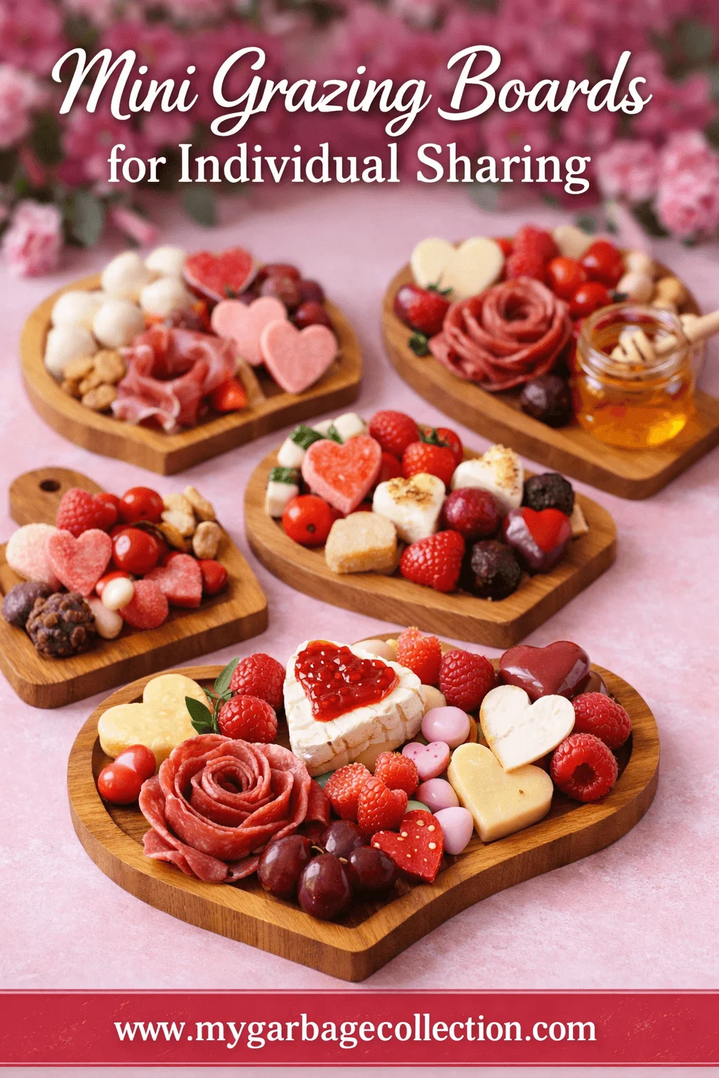 Mini grazing boards for individual sharing with heart themed wooden boards holding cheese cured meats strawberries grapes nuts sweets and honey on a pink background with website text mygarbagecollection.com