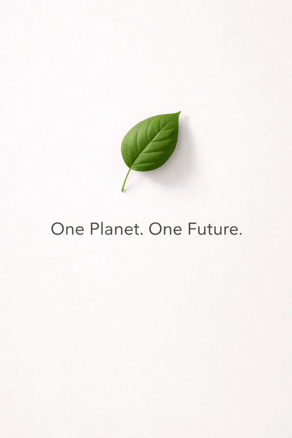 Minimal sustainability concept with a single green leaf on a clean white background and the message One Planet One Future representing environmental responsibility and a sustainable future.