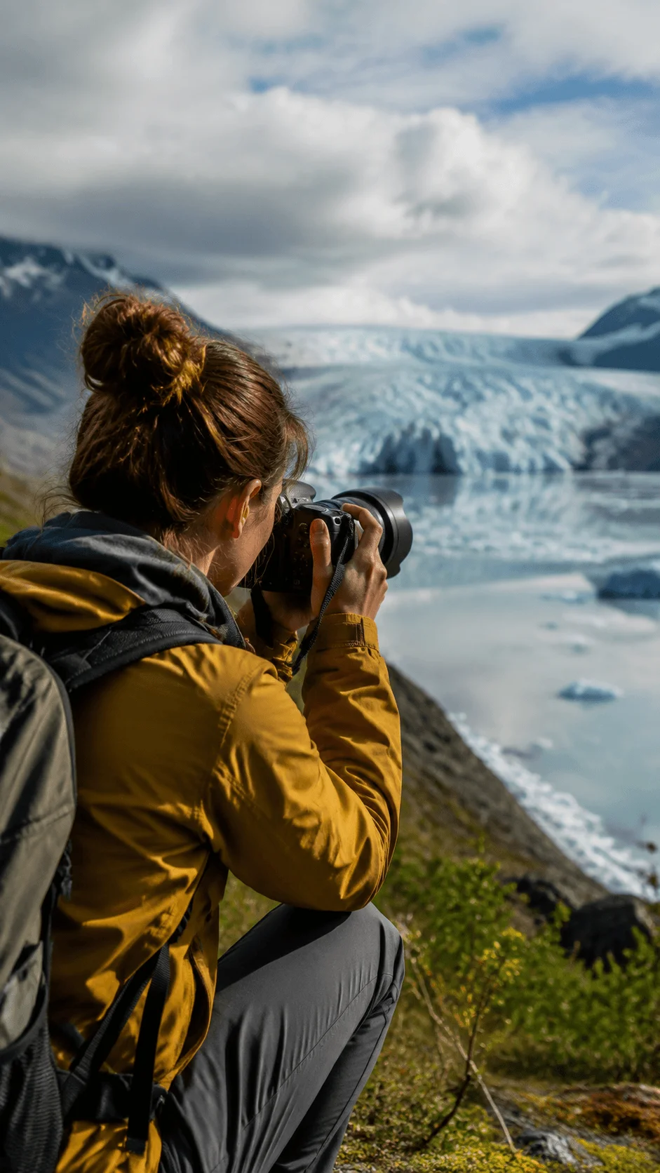 Career opportunities after a sustainable photography degree showing a photographer capturing a glacier landscape with camera equipment in a natural environment representing environmental photography, conservation, and climate awareness careers