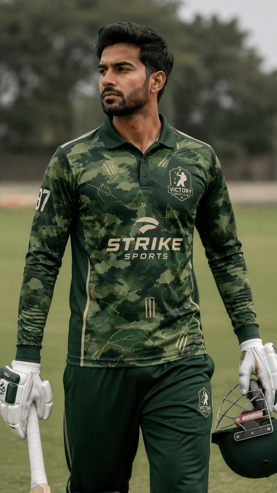 Green camouflage full sleeve cricket jersey with clean dark panels worn by a batsman holding a bat and helmet on a cricket field