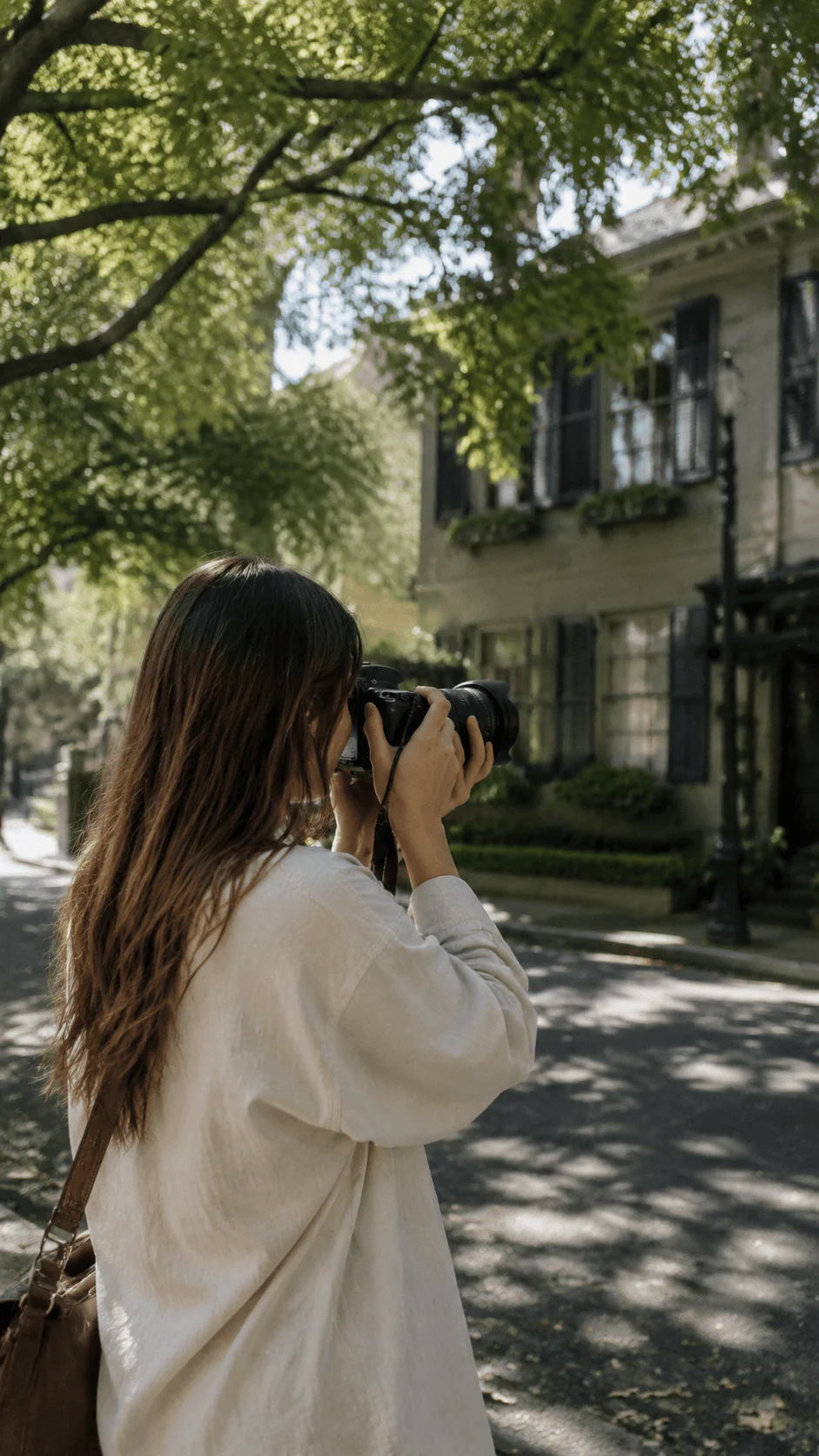Local location photography session showing a photographer capturing images outdoors on a tree lined street with natural surroundings and a sustainable lifestyle atmosphere