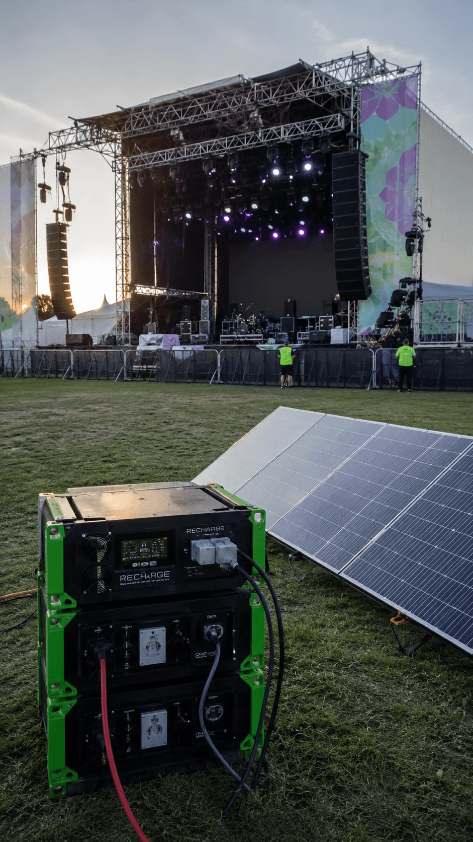 Battery powered outdoor festival stage using solar panels and energy storage equipment for sustainable event power